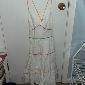 Adjustable straps with a tie in the back. White with multicolored stripes